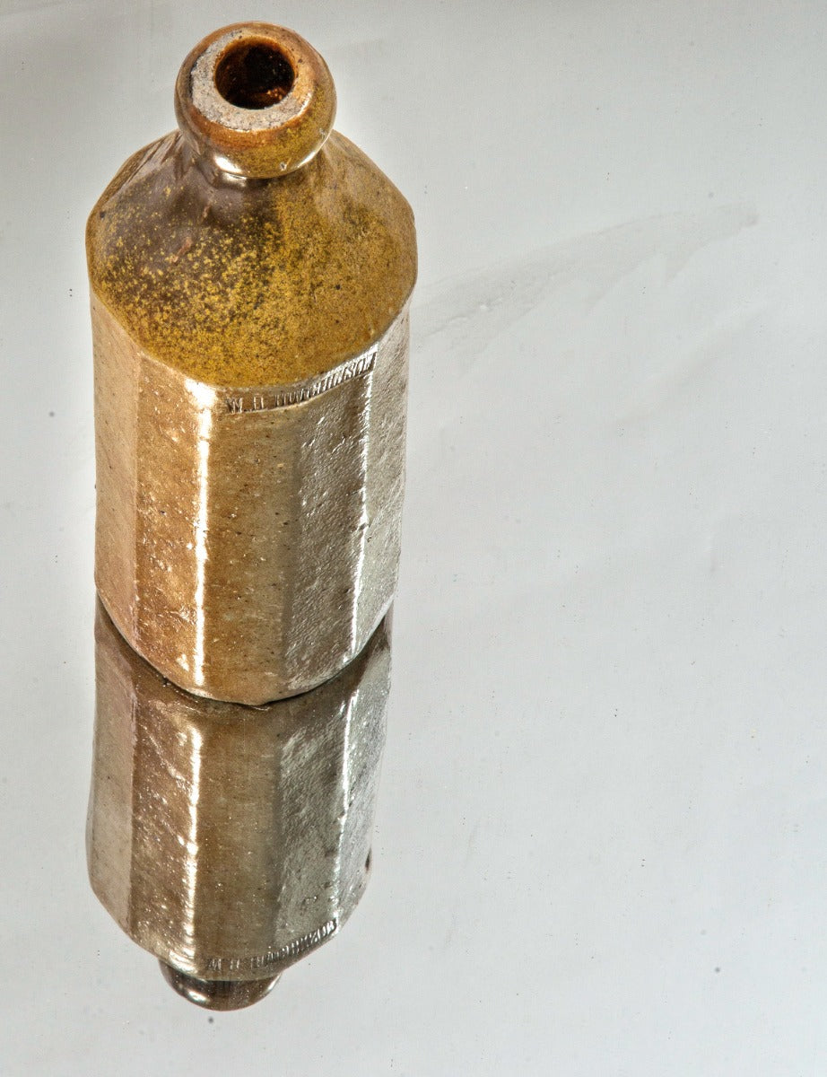 rare and historically important 1850s two-tone salt-glazed faceted william h. hutchinson pottery bottle dug from downtown chicago privy pit