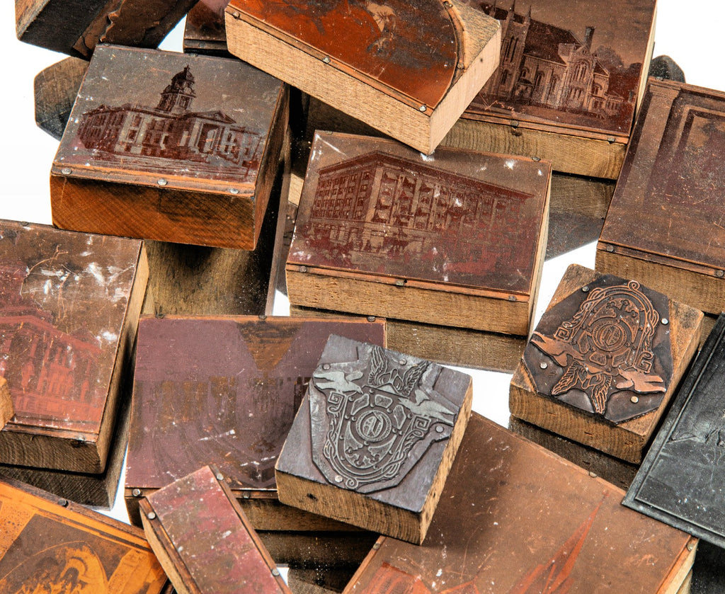 group of original early 20th century odin j. oyen print wood blocks of various commissions his design firm worked on within the midwest