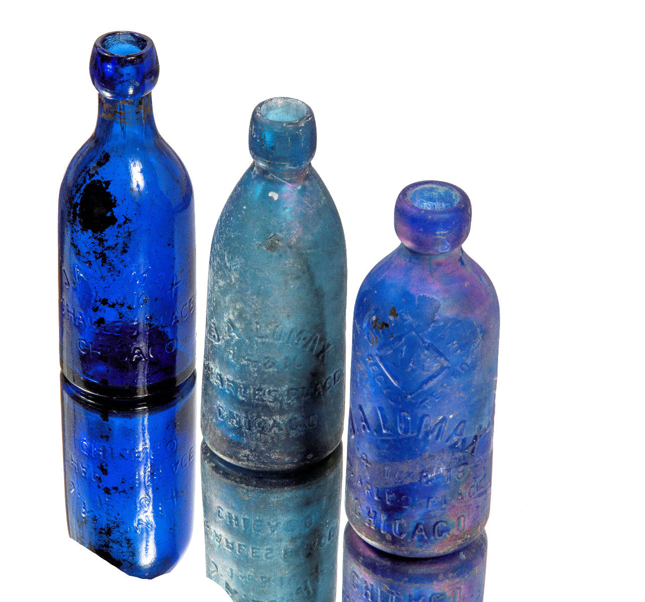 group of three chicago privy dug cobalt blue john a. lomax soda bottles
