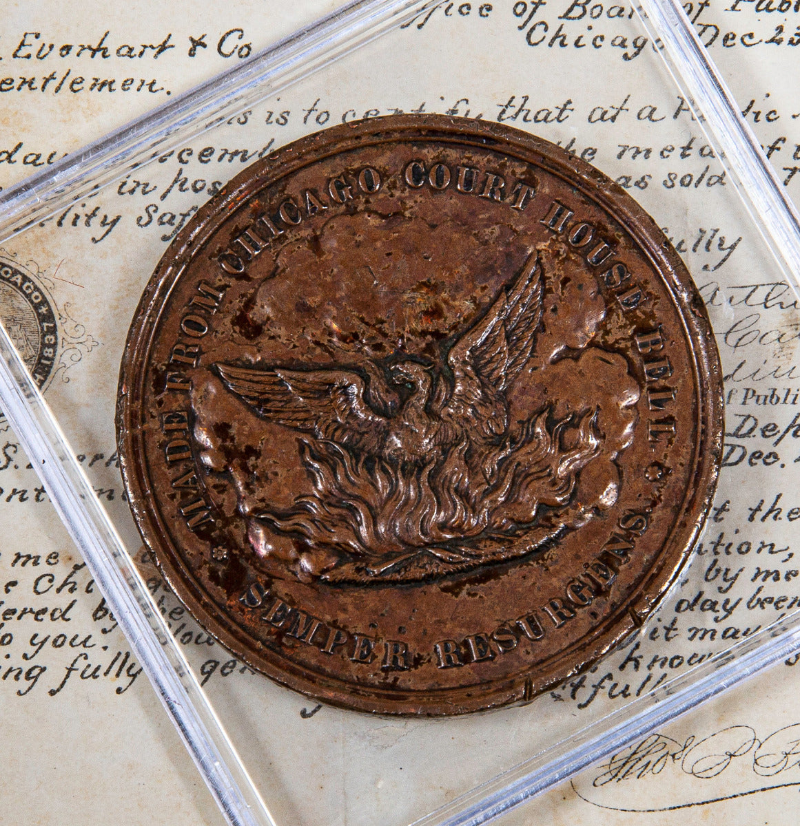 pocket-sized "souvenir" medal representing the first anniversary of the "great chicago fire" of 1871