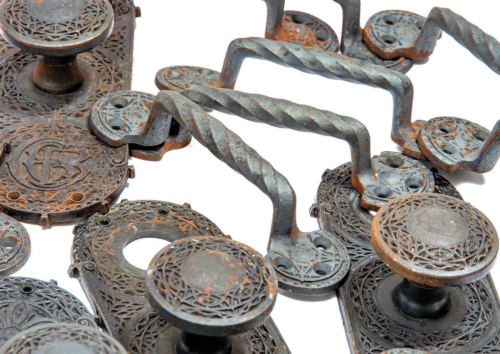 group of four original louis h. sullivan-designed cast iron chicago stock exchange building window sash pulls