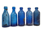 group of 1860s-1880s dug chicago cobalt blue john a. lomax soda bottles