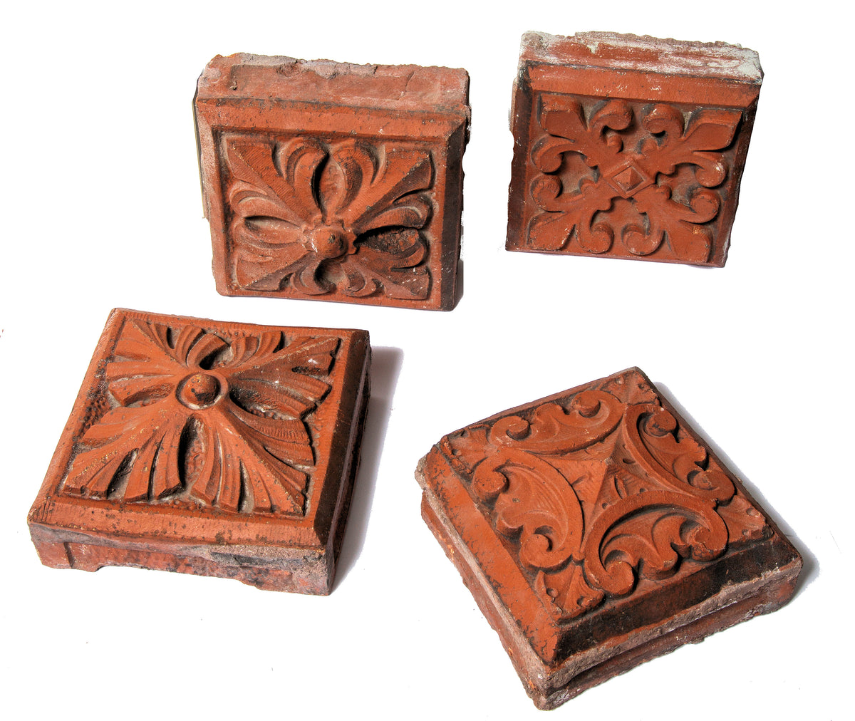 group of four 1880s red slip-glazed ornamental terra cotta blocks salvaged from la crosse, wisc. post office demolished in 1965
