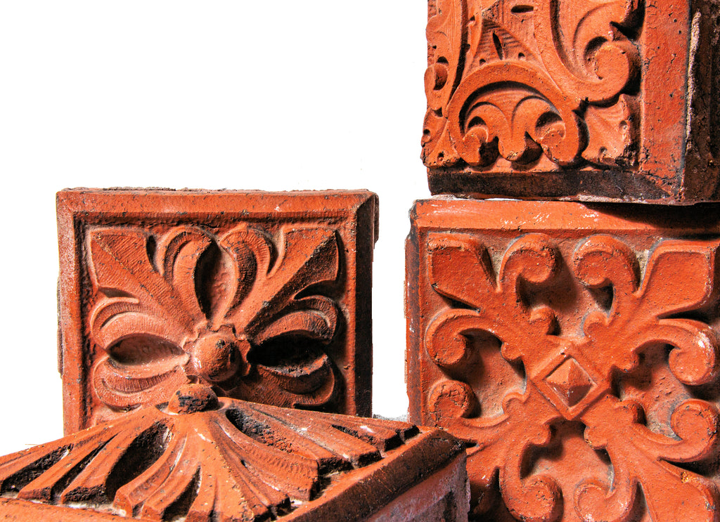 group of four 1880s red slip-glazed ornamental terra cotta blocks salvaged from la crosse, wisc. post office demolished in 1965