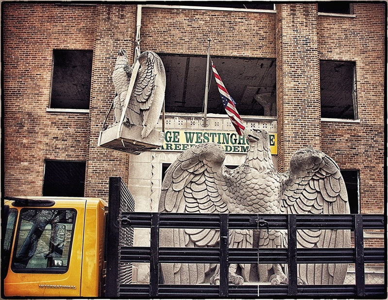 truly remarkable oversized historically-important bunte candy factory administration office tower hand carved c. 1919 spread-winged solid limestone exterior facade eagle