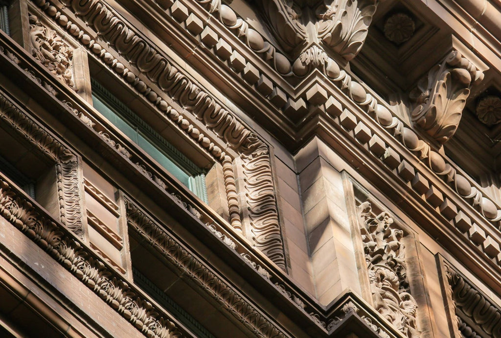 original glass fiber reinforced concrete (gfrc) marquette building (1895) exterior cornice rosette