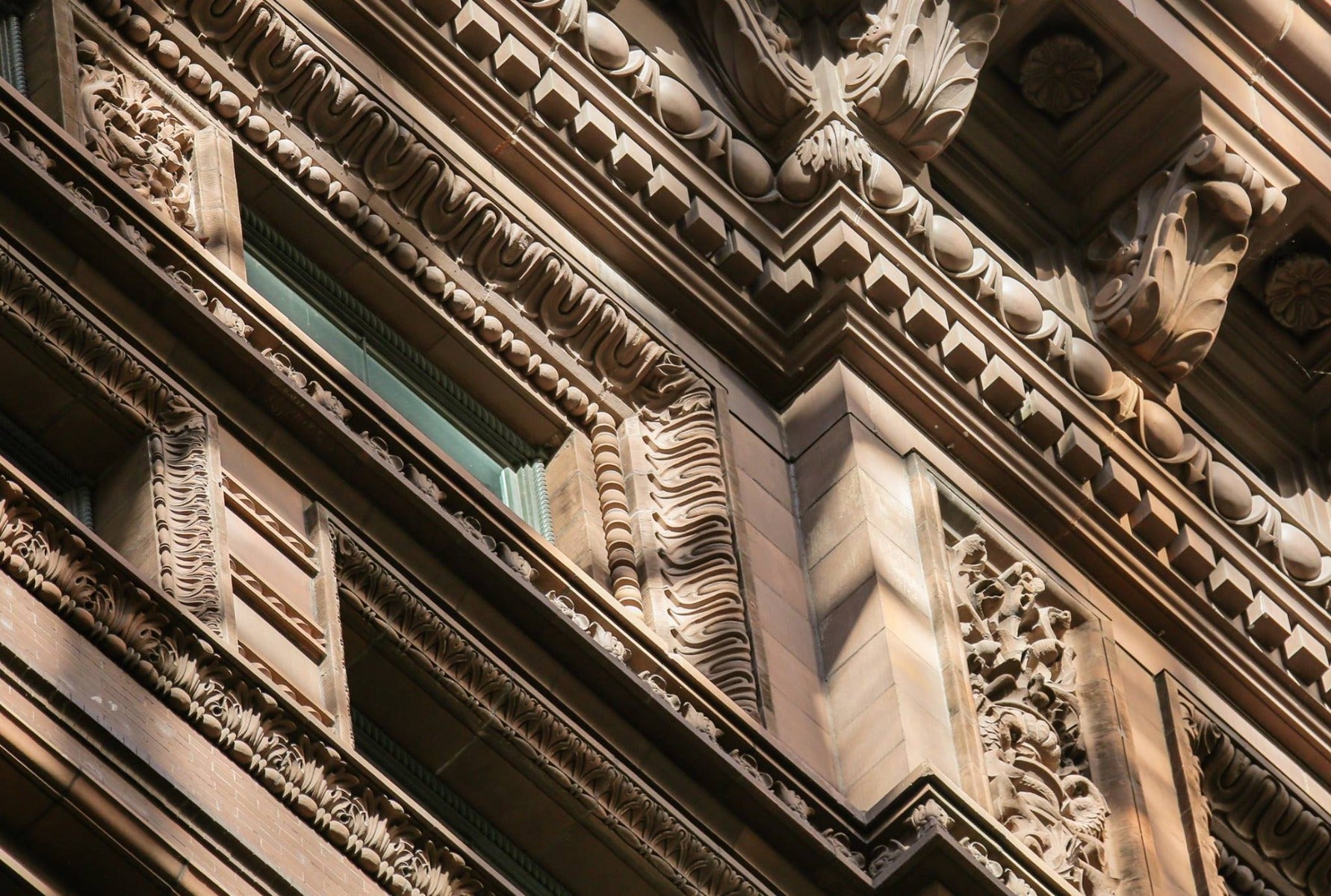 original glass fiber reinforced concrete (gfrc) marquette building (1895) exterior cornice rosette