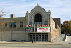 historically important late 1920's american exterior black glazed terra cotta figural dupage theater  facade "comedy" head or mask fragment with flowing hair