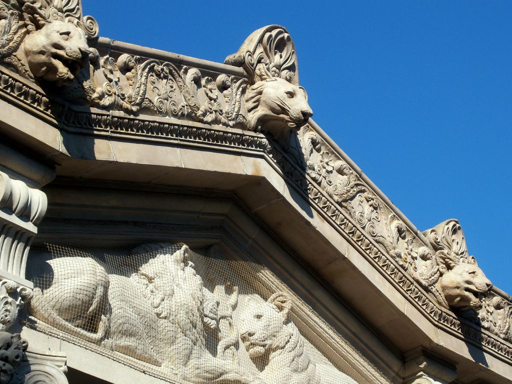 faithfully reproduced buff-colored oversized ornamental terra cotta lion panel replicated during restoration of the beaux-arts bronx zoo lion house