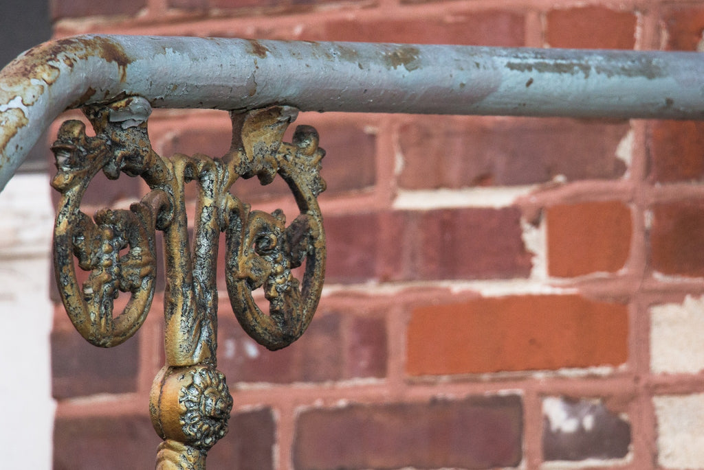 hard to find original 19th century ornamental cast iron exterior residential staircase pipe or stair rail bracket with intricate leafage and scrollwork