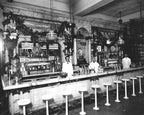 three matching hard to find c. 1920's american art deco style heavy cast iron soda fountain freestanding bar stools with original black and white porcelain enameled finish