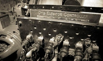 original early 20th century single-sided american industrial angled back crane brothers building otis elevator "controller" upright motor plaque with copper-plated finish