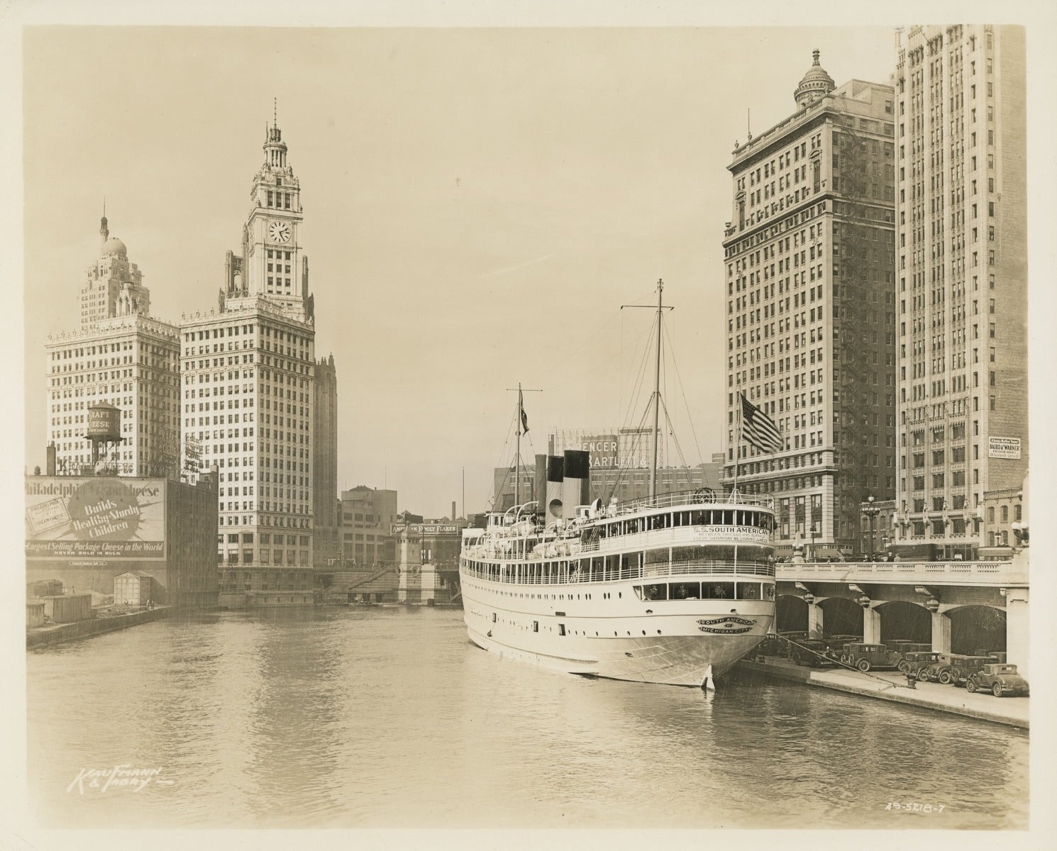 group of early 20th century kaufamnn and fabry silver gelatin prints of chicago buildings, boats, and bridges