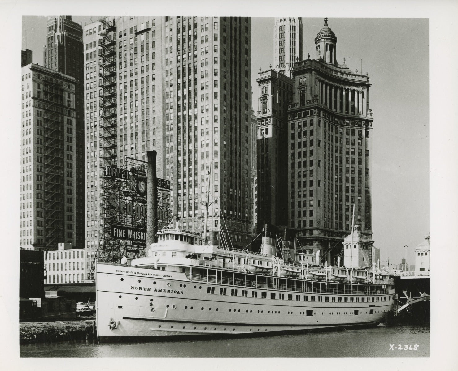 group of early 20th century kaufamnn and fabry silver gelatin prints of chicago buildings, boats, and bridges