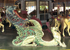 museum quality late 19th or early 20th century hand carved polychromed wood amusement park dragon carousel chariot side fragment with allover crazing
