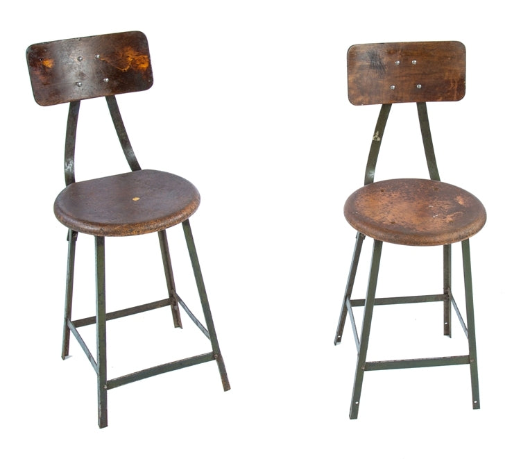 two matching original c. 1940's american industrial angled steel chicago factory machine shop four-legged stools with "pollard green" enameled finish
