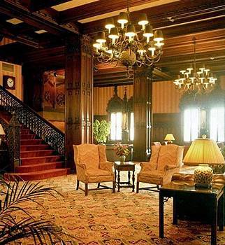 gargantuan c. 1930's heavily ornamented gothic style chicago athletic club reading room 16-arm ceiling patinated brass chandelier