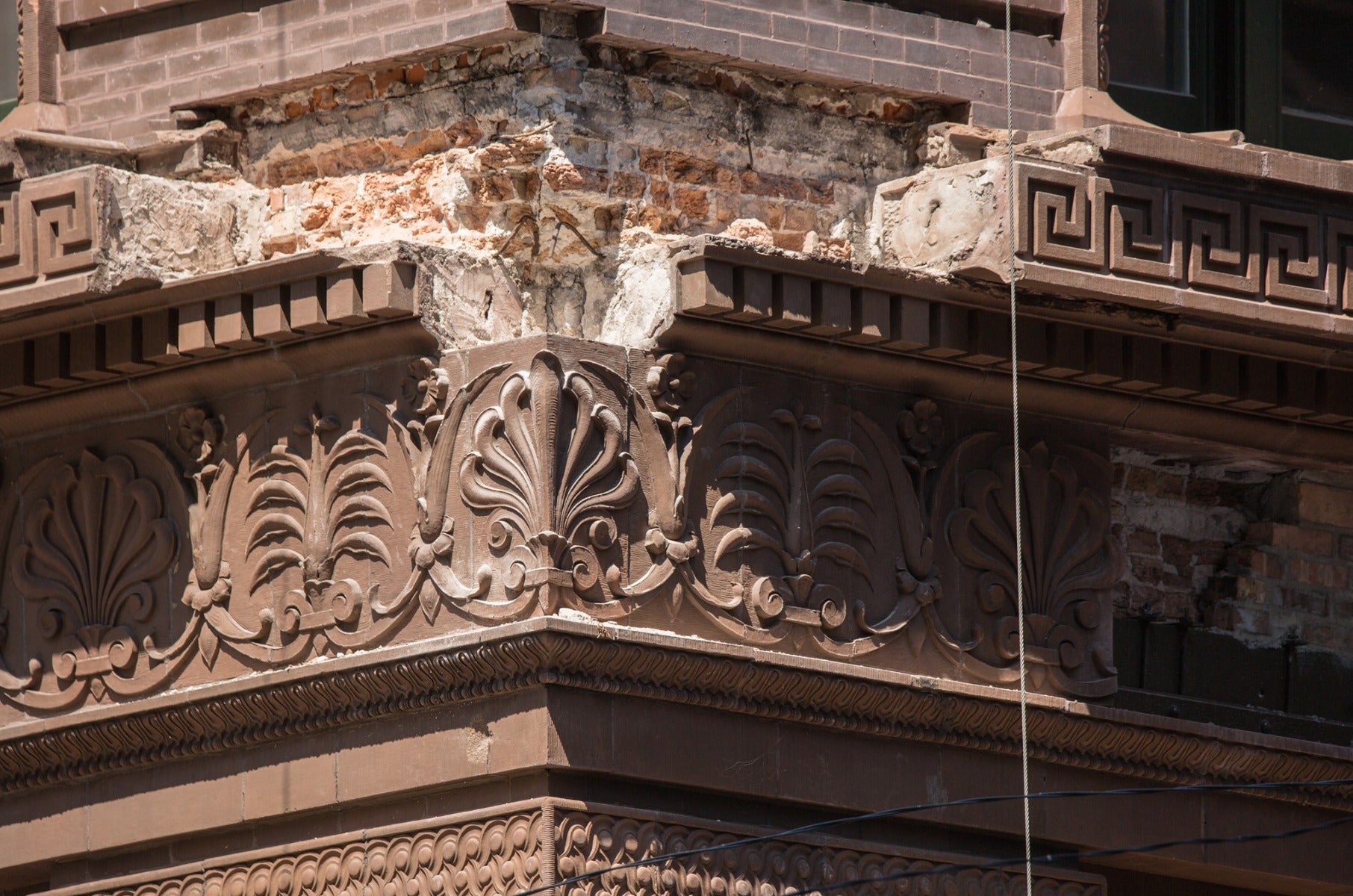 faithfully recast martin roche-designed marquette building terra cotta panel fabricated for building's restoration in 2019