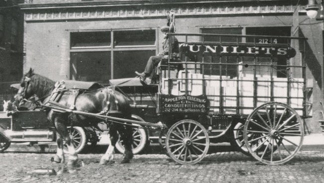 two matching oversized c. 1950's american vintage industrial chicago foundry "explosion proof" wall-mount electric sconces with detachable cages