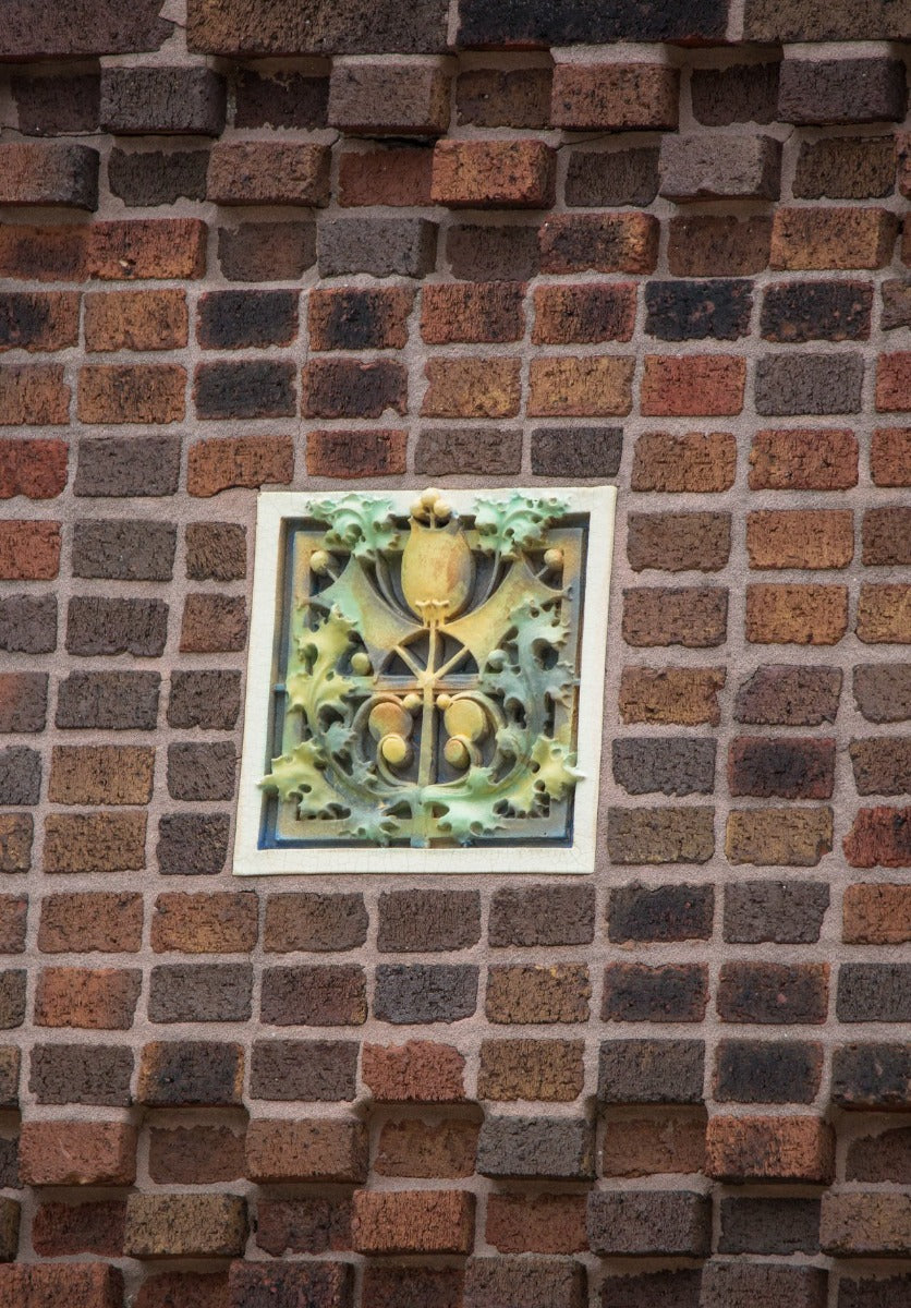 faithfully reproduced polychrome enameled plaster recast of a terra cotta panel adorning the exterior of louis h. sullivan's 1914 purdue state bank