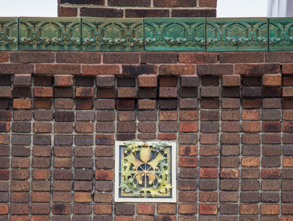 faithfully reproduced polychrome enameled plaster recast of a terra cotta panel adorning the exterior of louis h. sullivan's 1914 purdue state bank