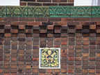 faithfully reproduced polychrome enameled plaster recast of a terra cotta panel adorning the exterior of louis h. sullivan's 1914 purdue state bank