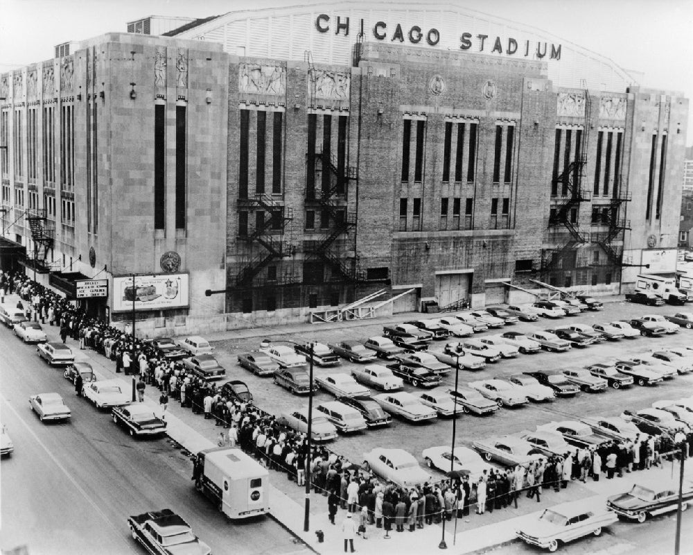 group of four matching heavily reinforced pressed and folded black enameled chicago stadium industrial folding chairs with original seat pads