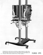 early 20th century antique american depression era oversized dearorff mobile 8 x 10 view camera stand or tilting crank table with turned wood handles and upright posts with counter-weights