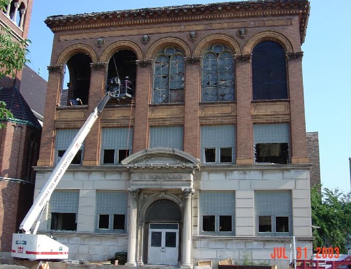 rare museum-quality largely intact st. boniface school exterior pilaster capital speckled terra cotta figural cherub with wings