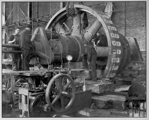 original late 19th or early 20th century oversized heavy cast iron american industrial steam engine rimmed flywheel with flared-end spokes and central hub