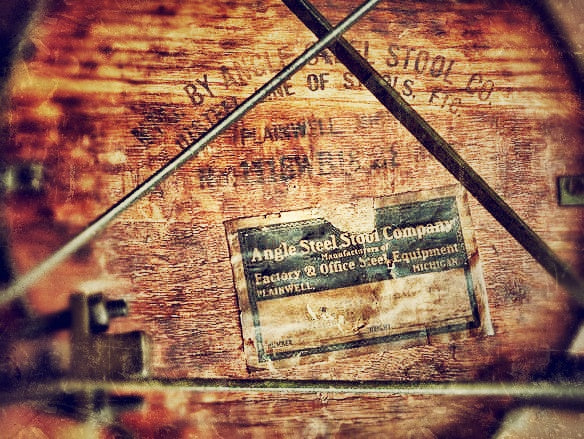 heavily worn original c. early 1940's vintage american industrial riveted joint three-legged factory machine shop stool with old backed black enameled finish