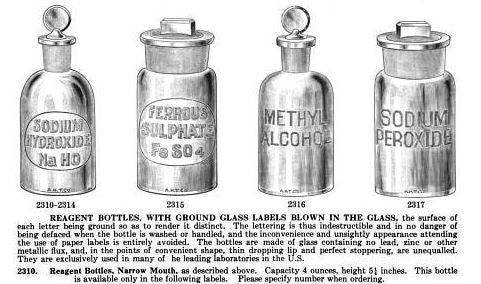 two matching vintage american industrial diminutive embossed cleat glass research laboratory reagent bottles with intact penny-shaped removable ground glass stoppers