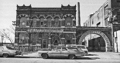 fully adjustable early 20th century black enameled cast iron brand brewery lunchroom table bases with double-sided footpads