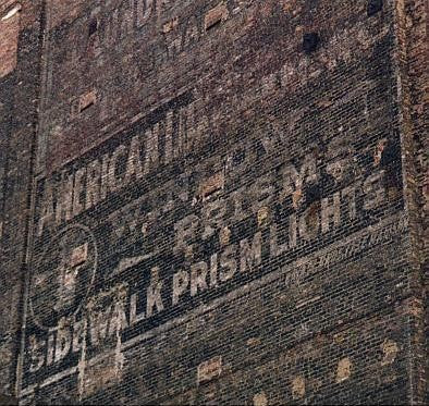 two early 20th century diminutive weathered green enameled ornamental single-sided cast iron hoops building facade window casing or mullion fragments