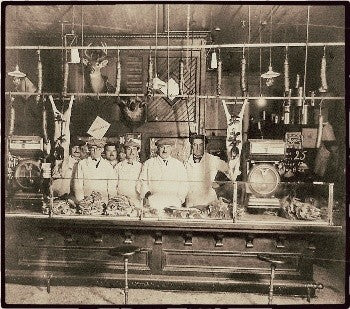 incredibly robust and heavy duty heavily worn turn of the century rock hard maple wood freestanding four-legged fulton market butcher shop table