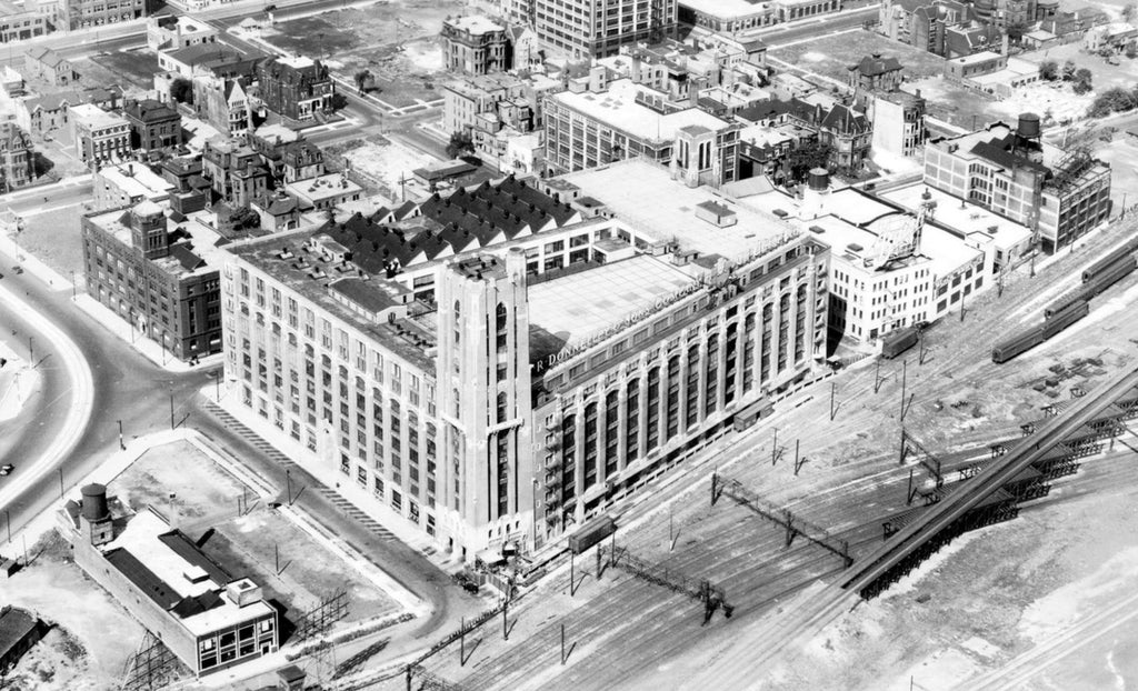 c. 1920's 24-karat gold glazed ornamental terra cotta r.r. donnelley printing plant exterior facade shield with hand trowel