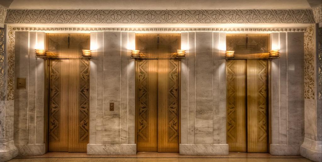 original william drummond-designed heavy cast brass rookery building elevator light with frosted glass globes