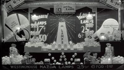 unusually small early 20th century five-light mazda edison tin-lithographed light bulb hardware store counter display with individual sockets and on/off switches