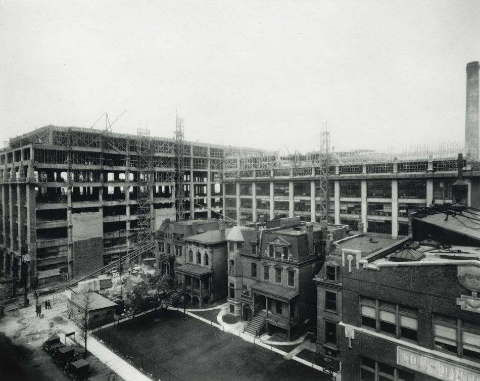 c. 1920's 24-karat gold glazed ornamental terra cotta r.r. donnelley printing plant exterior facade shield with hand trowel