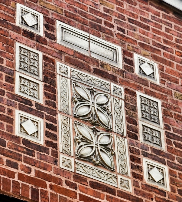 two matching original early 20th century antique american white glazed "sullivanesque" style diminutive terra cotta building facade blocks with allover crazing
