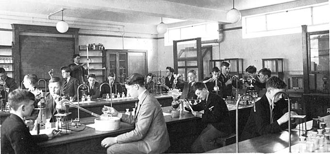 nice-sized american industrial early 1940's original science laboratory workbench with four-legged oak wood base and genuine slate top