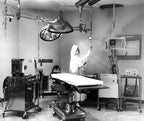 fully functional vintage american medical dual arm hospital operating room ceiling-mount surgical lamp with "stepped" dome-shaped lampheads