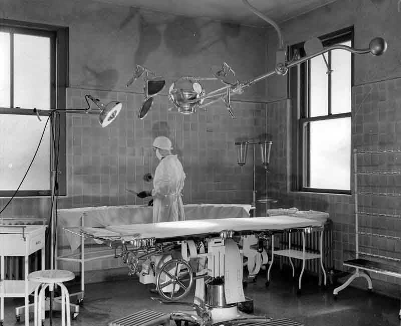 original c. 1910-20 american antique medical green painted angled steel three-tier hospital operating room workstation or stand with intact bassick swivel casters