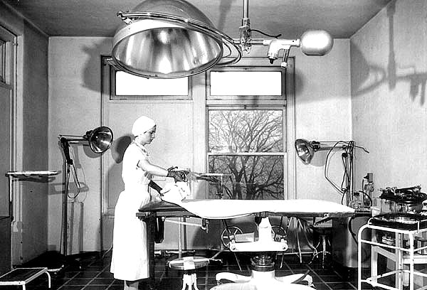 fully functional vintage american medical dual arm hospital operating room ceiling-mount surgical lamp with "stepped" dome-shaped lampheads