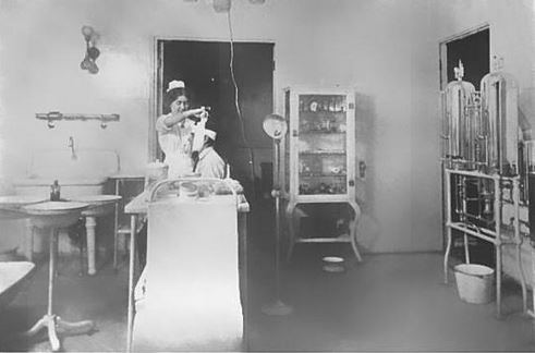 c. 1915 original fanciful cast iron and cold-rolled heavy gauge steel mobile hospital operating room fully enclosed storage cabinet with brushed metal finish