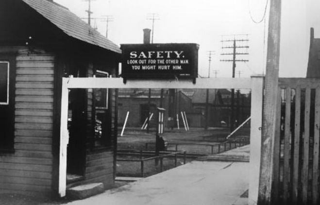c. 1940's original oversized single-sized american industrial "careful worker" die cut steel enameled safety factory sign