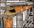 single shortened 19th century chicago balloon frame american industrial solid pine wood residential foundation post or piling repurposed into a freestanding display stand