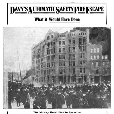 largely intact early 20th century american commercial building wall-mount "davy" fire escape device with original lithographed steel canister