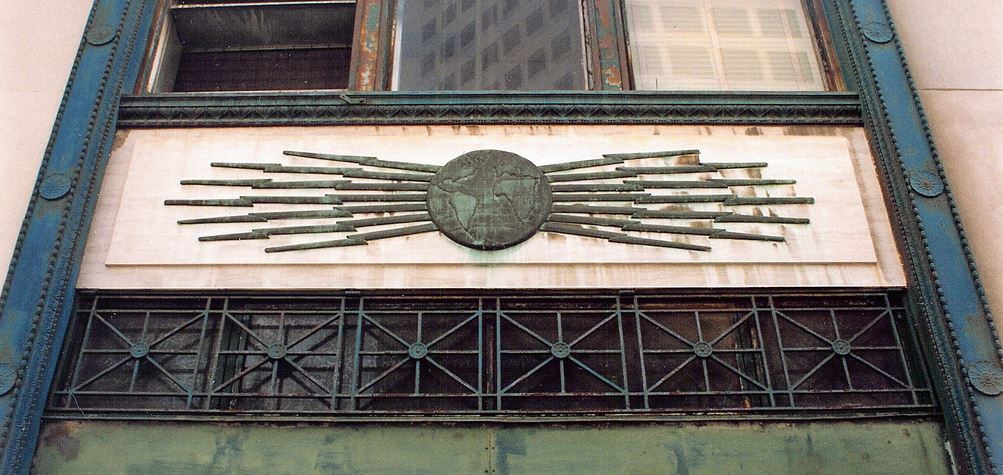 very rare c. 1920's american art deco cast bronze western telegraph company building exterior facade ornament featuring a globe flanked by lightning bolts