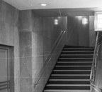 historically-important oversized flush mount american art deco streamlined style chicago board of trade building interior lobby illuminated polished brass wall sconce with cylindrical frosted glass shade